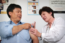 photo of a doctor administering an injection to a patient.