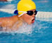 image of a woman swimming laps in a pool