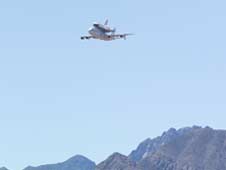 (NASA WSTF Photo) Space Shuttle Atlantis makes a low pass with the Organ Mountains in the background on June 1, 2009.