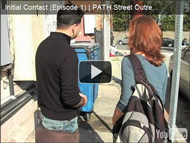 image of a man and a woman walking down the sidewalk-click to view video