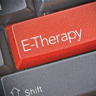 photo of a computer button reading “E-Therapy”