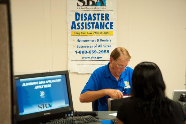 Pascagoula, Miss., Sep. 5, 2012 -- A survivor of Hurricane Isaac completes the application for disaster assistance with a representative of the Small Business Administration. Disaster Recovery Centers have all the representatives of state and federal agencies to assist applicants. 