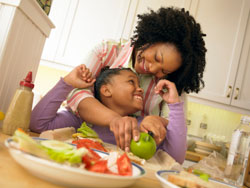 photo of a mother and daughter eating