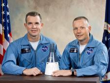 Astronauts David R. Scott (left), Pilot; and, Neil A. Armstrong (right), Command Pilot, pose with model of the Gemini Spacecraft after being selected at the crew for the Gemini VIII mission.