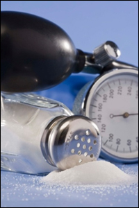 Spilled salt in front of a blood pressure monitor