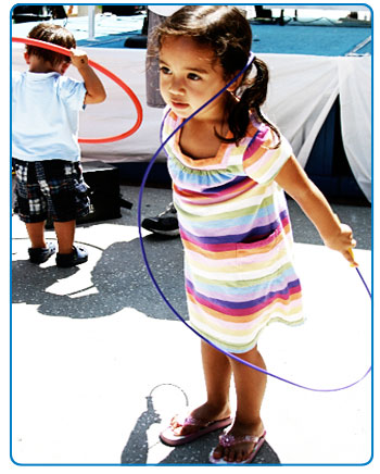 A young girl jumps rope at the Fit Kids Playground event