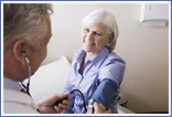 Woman having her blood pressure taken