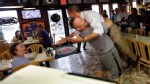 PHOTO: President Barack Obama is picked up and lifted off the ground by Scott Van Duzer, owner of Big Apple Pizza and Pasta Italian Restaurant, during an unannounced stop on Sept. 9, 2012, in Ft. Pierce, Fla.