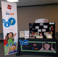 The ODS booth for wellness conferences incorporates We Can! materials.