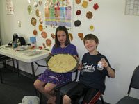 Two young chefs pose with their healthy creation after a Healthy Kids Clinic cooking demonstration.