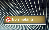No smoking sign hanging on an industrial roof
