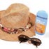 A hat, sun glasses and sunscreen