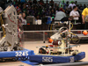 Tehachapi High's Vesuvius robot (585) mixes it up during competition as a judge (in yellow shirt) monitors play at the FIRST Robotics regional competition in Las Vegas April 6.