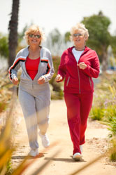 Two women walk together.