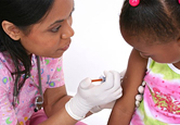 A young girl gets her flu shot