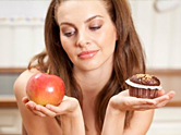 Woman must decide between a cupcake and apple