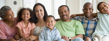 Photo: A family seated on a couch