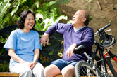 A couple laughs together during their biking trip.