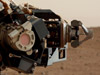 Camera on Curiosity's Arm as Seen by Camera on Mast