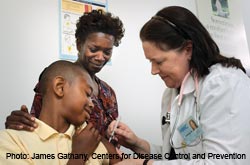 A doctor giving a child the vaccine