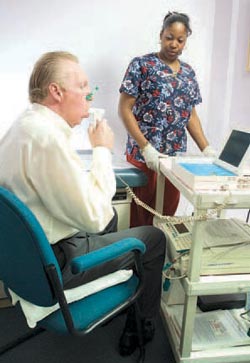 A man taking a breathing test