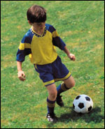 child playing soccer