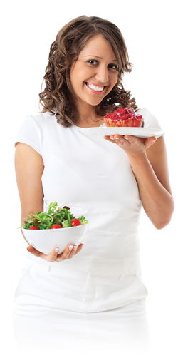 Woman holding a salad and a dessert