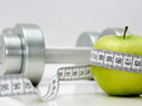 image of  green apple, free weight, and tape measure   