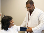 image of  doctor taking a patient’s blood pressure