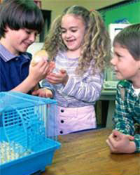 Children holding animal