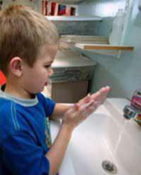 Boy washing hands