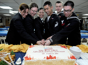 Six sailors celebrate on March 8, 2010, after becoming U.S. citizens onboard the USS Blue Ridge in Busan, South Korea. Pictured are Machinist's Mate 3rd Class Tara Steiner, Culinary Specialist 3rd Class Leonara Laybag, Culinary Specialist 3rd Class Mevin Sibal, Boatswain's Mate 2nd Class Raphael Zakar and Logistics Specialist 3rd Class Jun Wu. (Photo courtesy of the U.S. Navy)