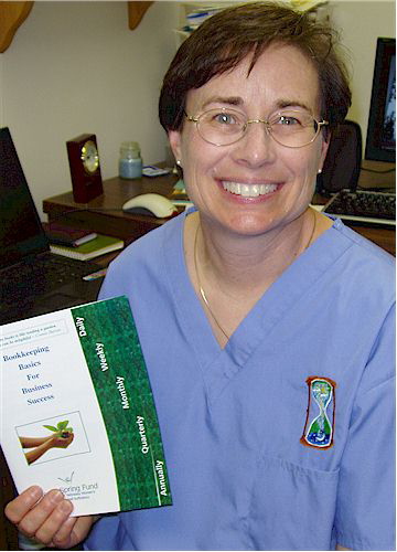 Connie Harvey with her brochure "Bookkeeping Basics for Business Success"