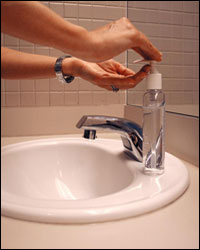 Photo: Using hand sanitizer