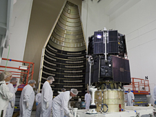 Technicians prepare the RBSP spacecraft for encapsulation in the payload fairing