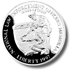 Obverse and reverse of National Law Enforcement Officers memorial silver dollar.