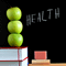 Stack of apples on top of books
