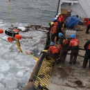 Crewmembers Remove Spilled Oil from Ice (USCG)
