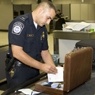 CBP agent inspects a bag