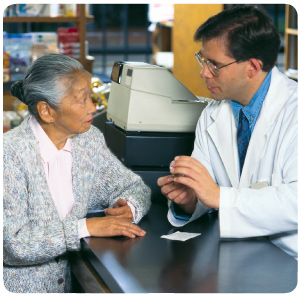 Pharmacist explaining details of a prescription medication to a customer