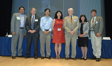 Photo of Atul Butte, Stanford University; John Glaser, Siemens Healthcare; Xinghua Lu, University of Pittsburgh; Hong Yu, University of Wisconsin-Milwaukee; Ted Shortliffe, AMIA (moderator); Joan Ash, OHSU; and Jim Cimino, NIH Clinical Center.