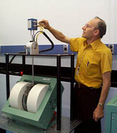 Bob Thurber connecting cables to the sample holder for a Hall effect measurement.