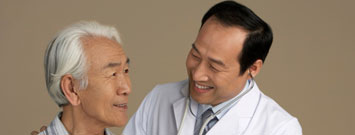 Photo: Doctor talking to older man