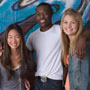 Three teenagers smiling