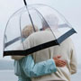 Photo: Man and woman under an unbrella
