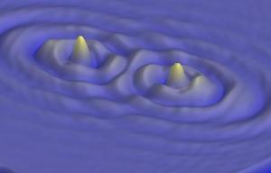 Micromagnetic simulations showing the spin-wave interaction between two local spin transfer oscillators. Each device emits spin-waves towards the other, causing the devices to synchronize. 