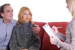 Couple talking with doctor