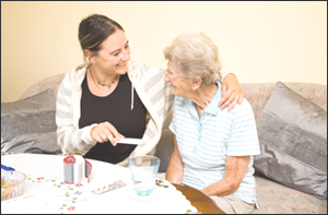 Healthcare worker with elderly woman