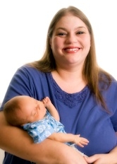 Overweight mother holding baby