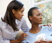 Picture of a young woman caring for her mother.